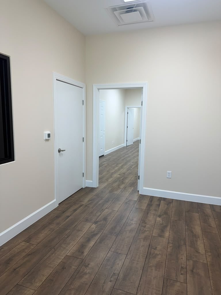 Finished commercial hallway with new laminate flooring