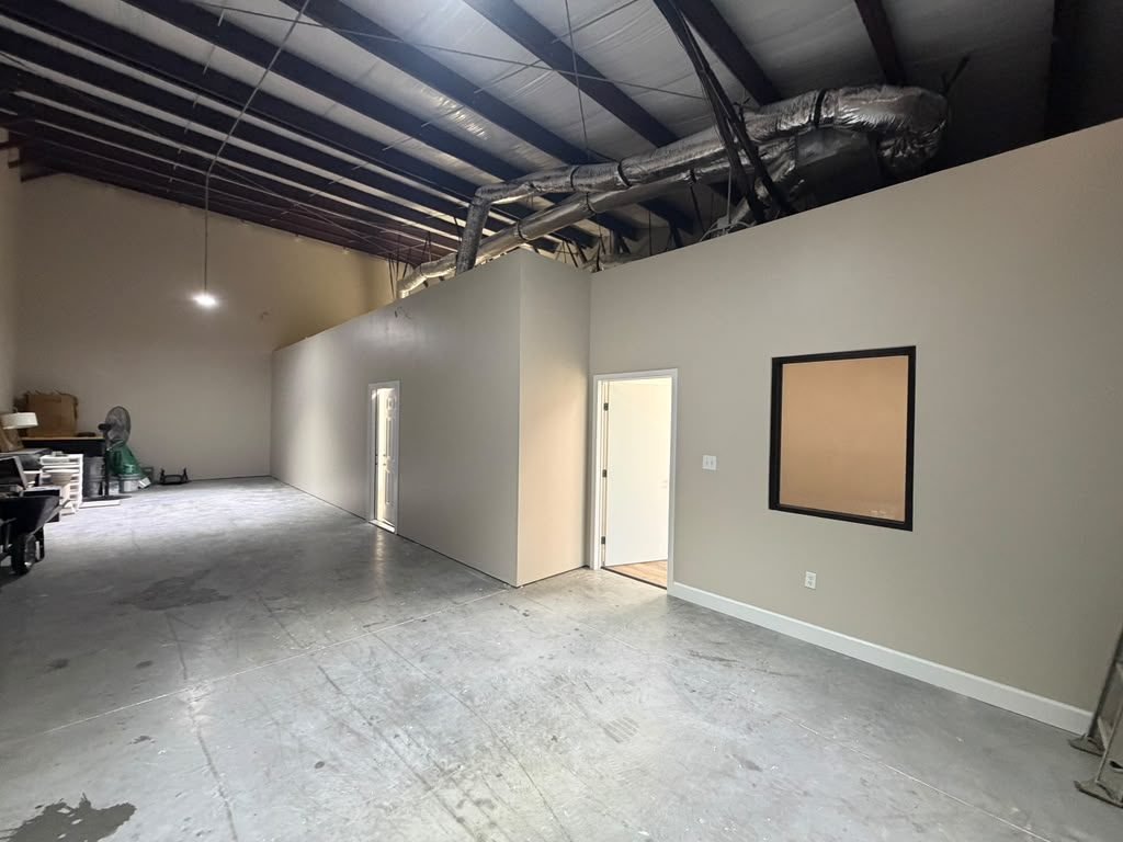 Laminate flooring being installed during a commercial build-out