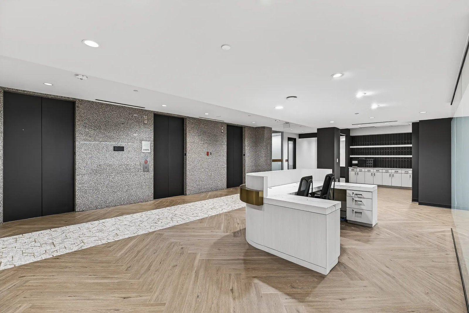 Commercial office reception hallway with marble flooring
