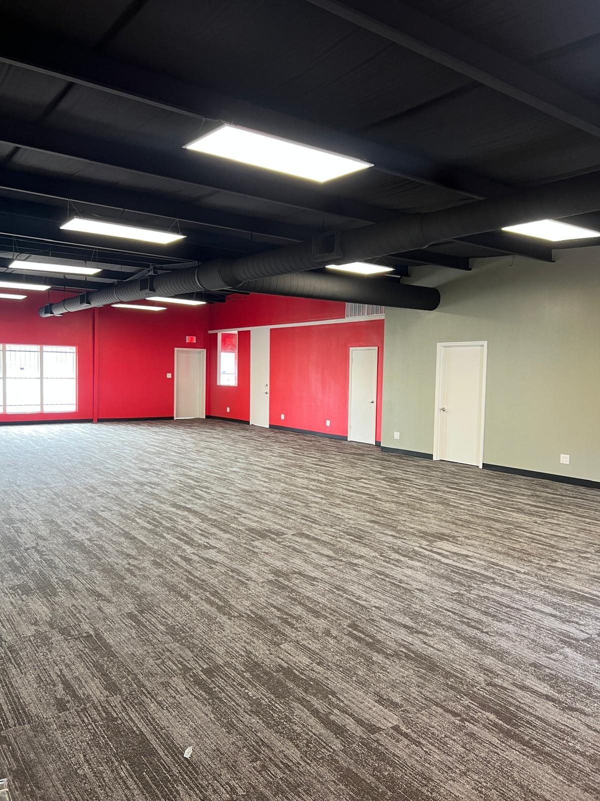 Finished commercial interior with bold accent-wall paint and new flooring