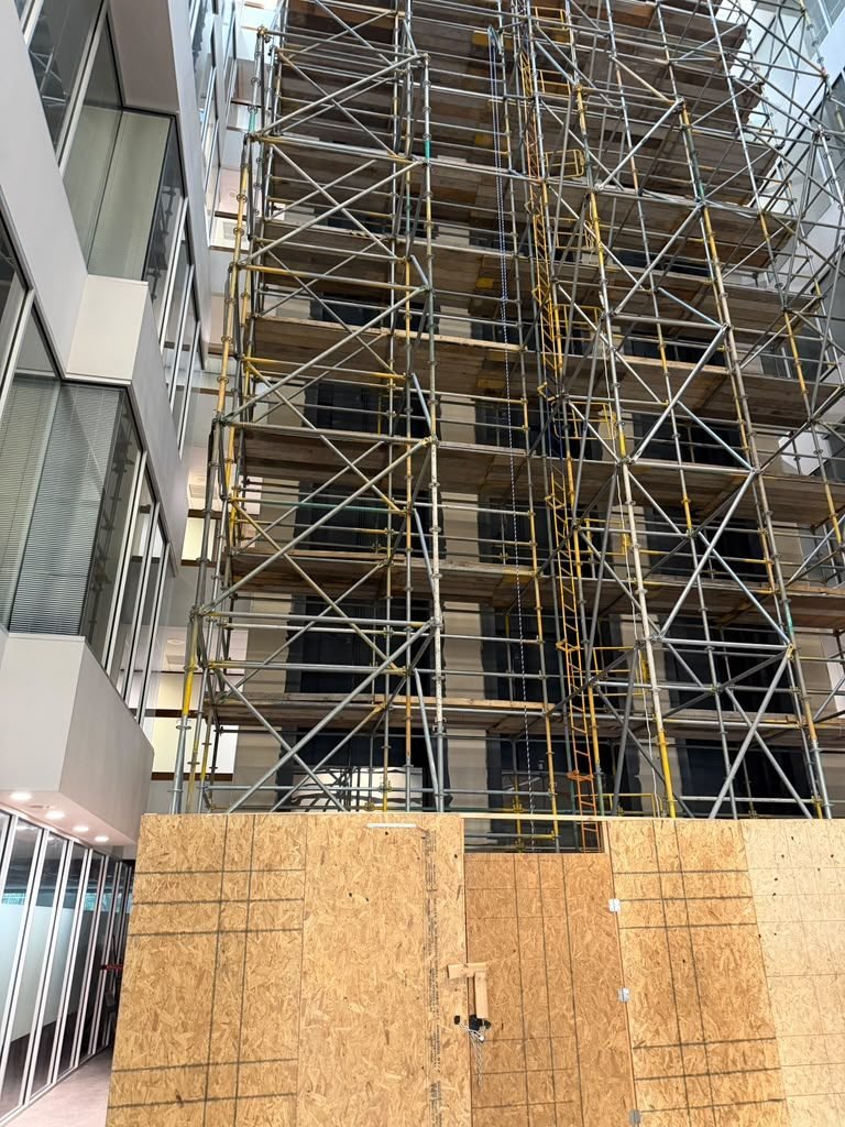 Interior scaffolding and OSB framing during a commercial build-out