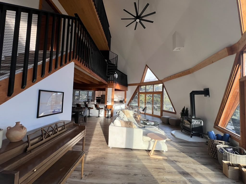 Renovated living room with wood-burning stove and custom finishes