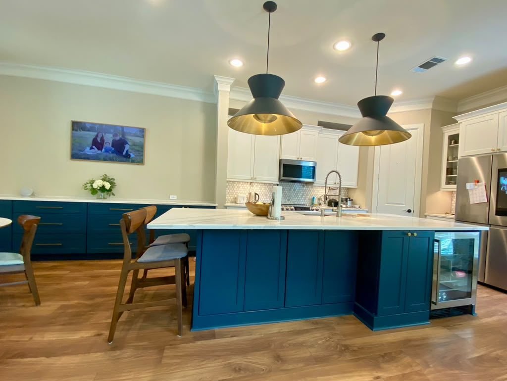 Finished kitchen remodel with custom island and pendant lighting